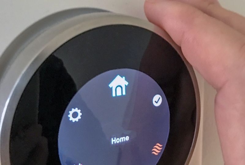 smart-home-thermostat-technology-with-hand-2022-11-14-06-40-22-utc