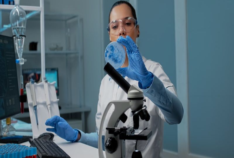 Chemistry scientist using research equipment in laboratory