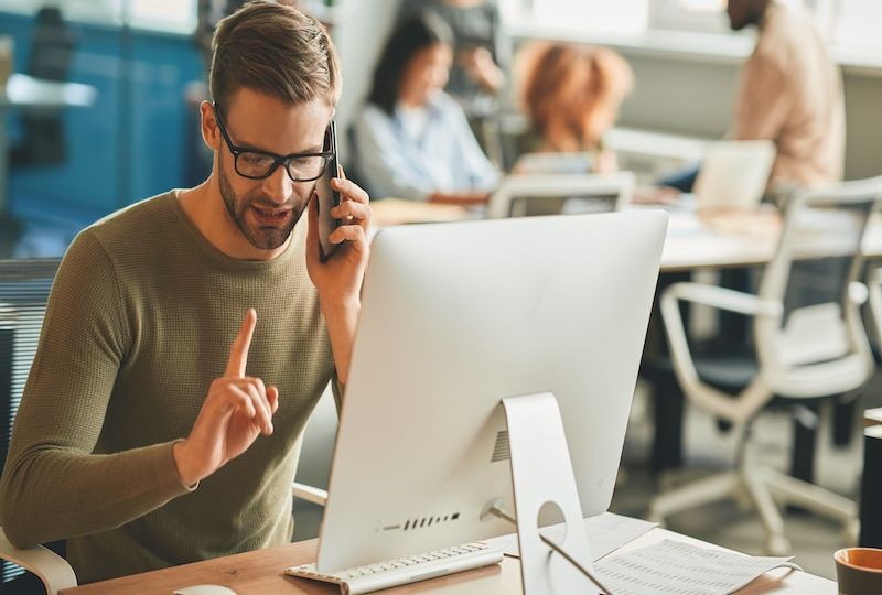 Patient call-center operator gesturing during a phone-call